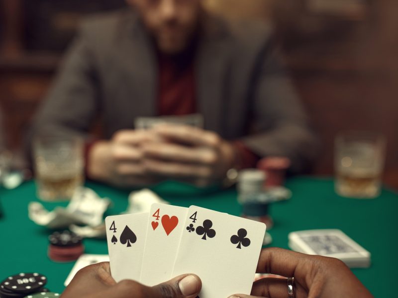 Male hands with cards, poker, games of chance